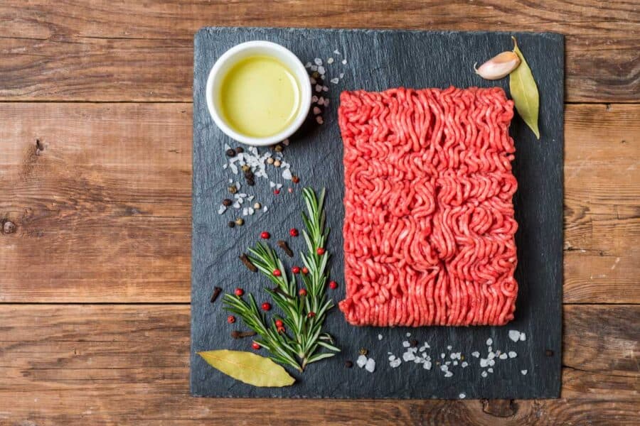 Ground meat on slate with spices