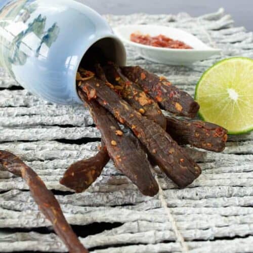Chili Lime jerky with lime and chili garlic sauce in jar