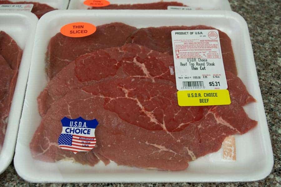 Beef top round sliced thin in package