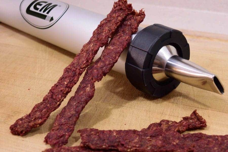 A rich and flavorful ground meat beef jerky that is easy and quick to make! No marinading required. Everyone will love these meaty protein snacks. | Jerkyholic.com