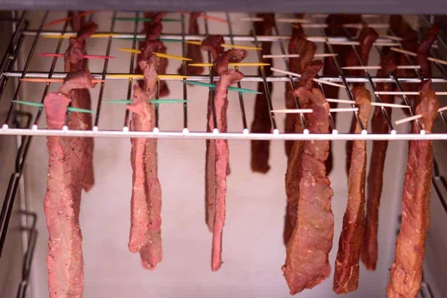 Tennessee Smoked Beef Jerky Hanging in Smoker