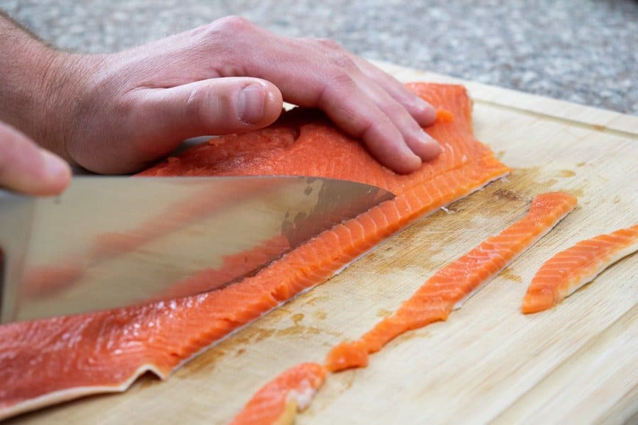 Slicing salmon fillet for salmon jerky