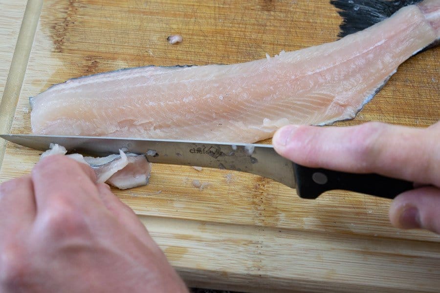 deboning trout on cutting board