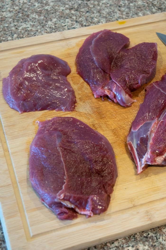 Venison steaks on cutting board