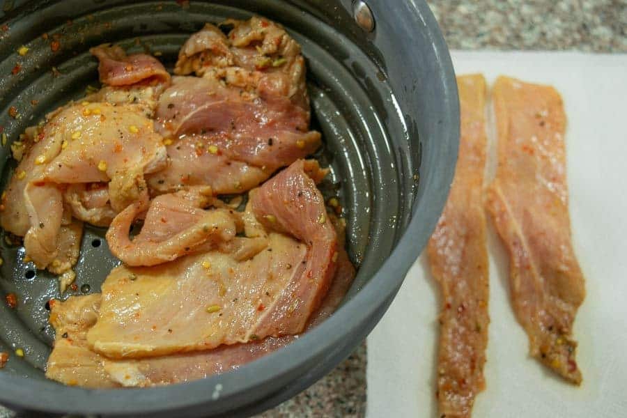 Italian pork jerky strained in colander