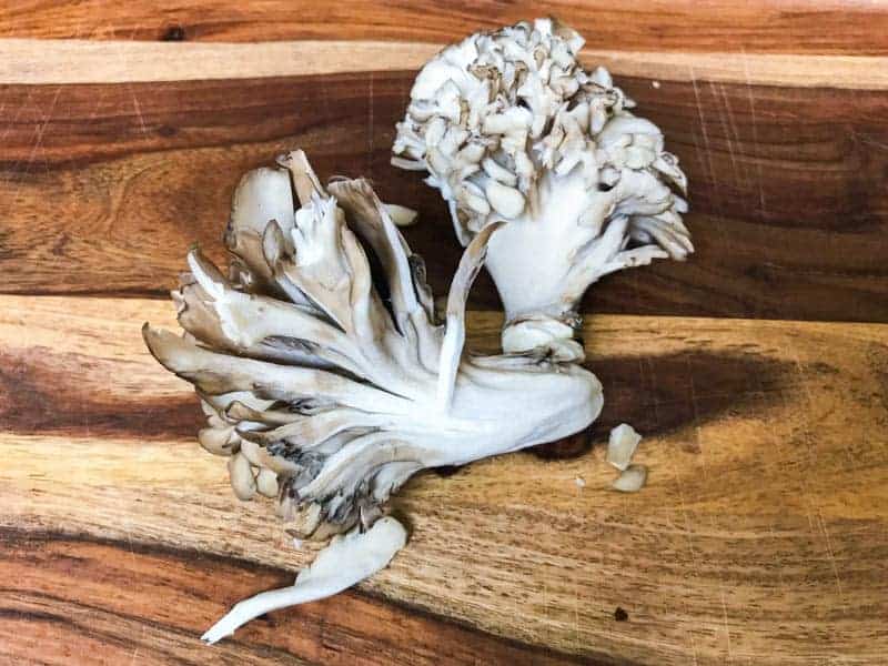 Raw Maitake Mushrooms on cutting board