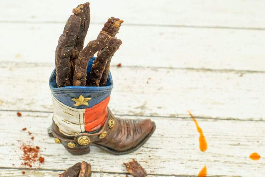 Beef jerky in cowboy boot painted with texas flag