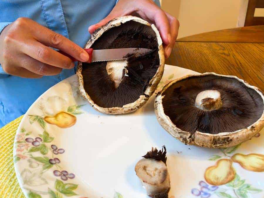 Cutting gils off of Portobello mushroom