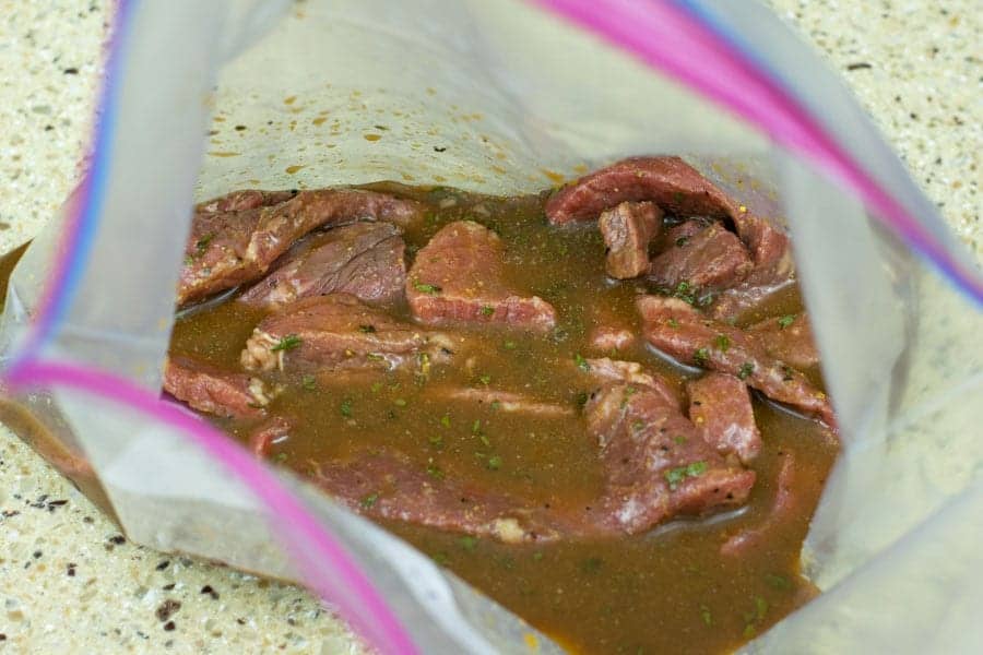 beef jerky marinating in ziplock bag