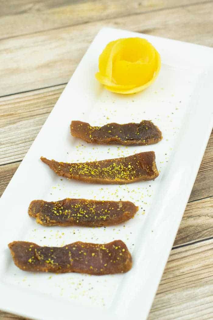lemon fish jerky on platter with lemon peels