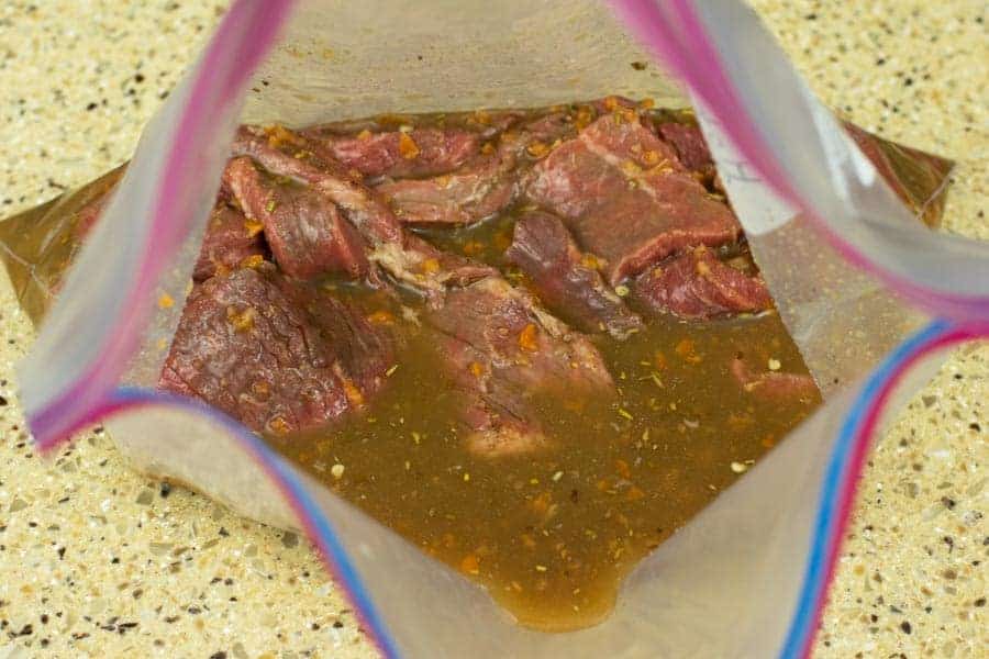 jerky strips marinating in ziplock bag