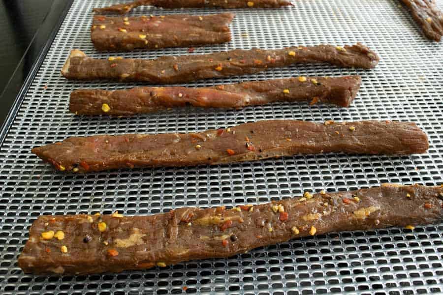 Beef Jerky strips on dehydrator tray