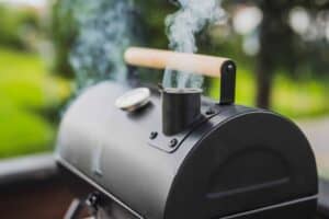 Smoker grill with smoke coming out