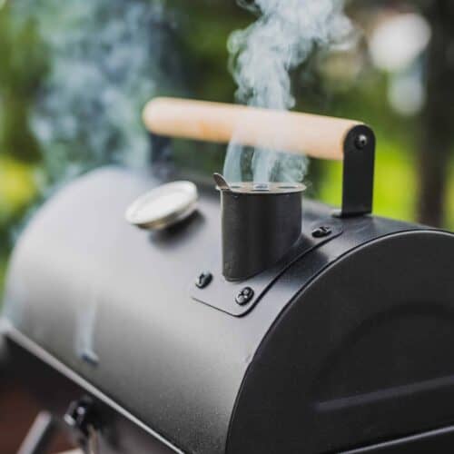 Smoker grill with smoke coming out