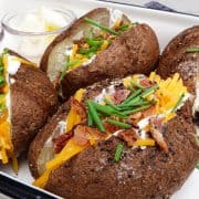 loaded baked potatoes in dish