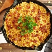 smoked mac and cheese in cast iron with spoon on side