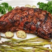 Tri tip steak on plate with potatoes and asparagus