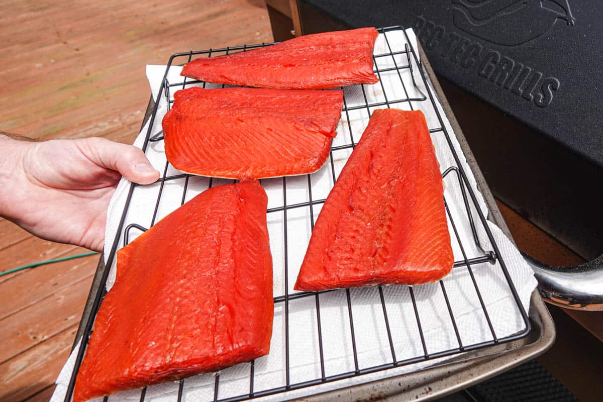 Four salmon fillets on cooling rack