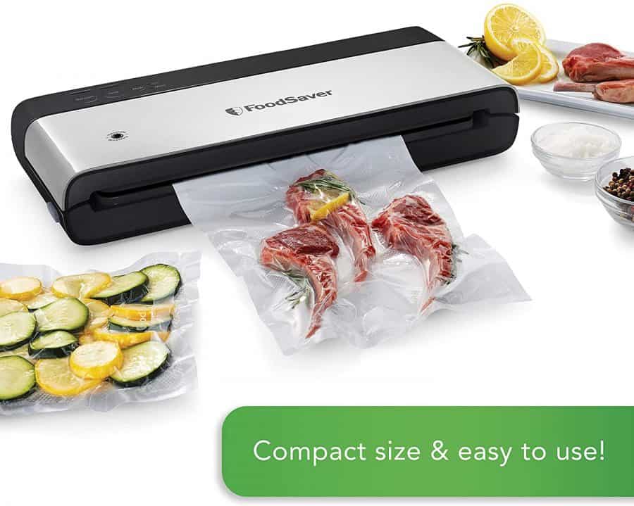 vacuum sealer with sealed lamb, vegetables, and fruits in bags