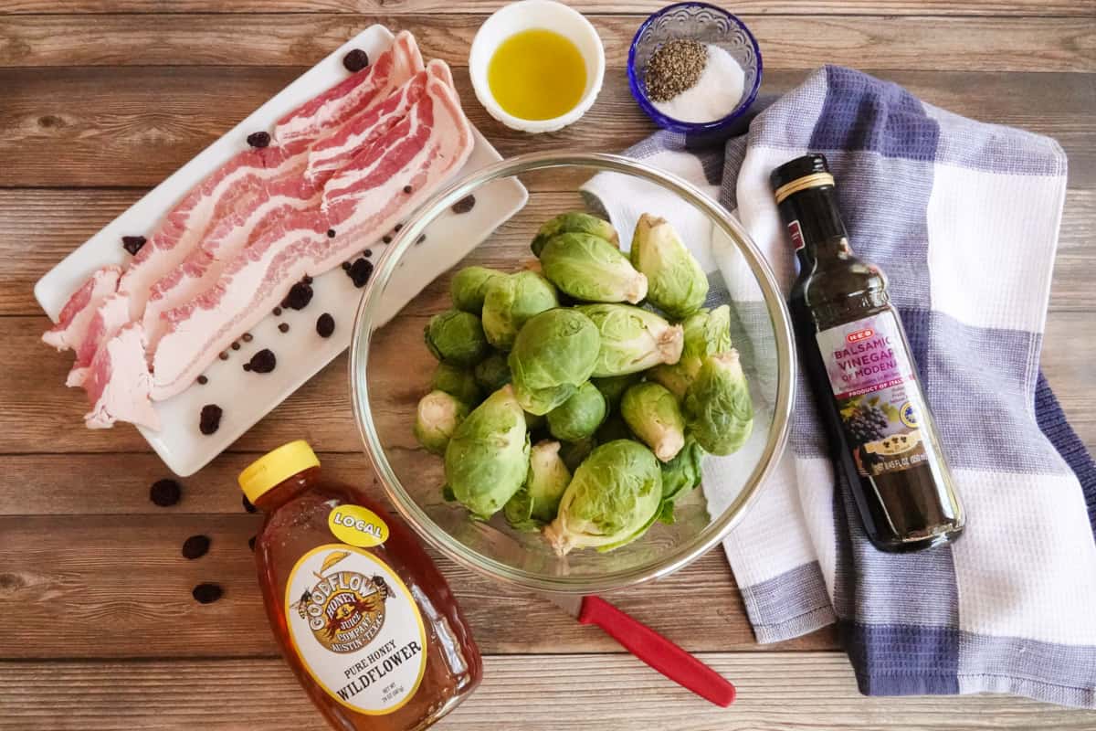 brussel sprouts, bacon, honey, salt and pepper, and balsamic vinegar on a table