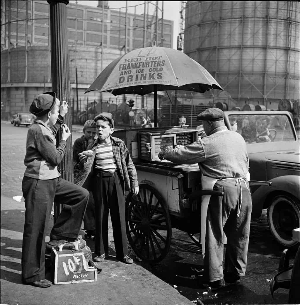 Two boys at hot dog cart in New York in the 1920's.