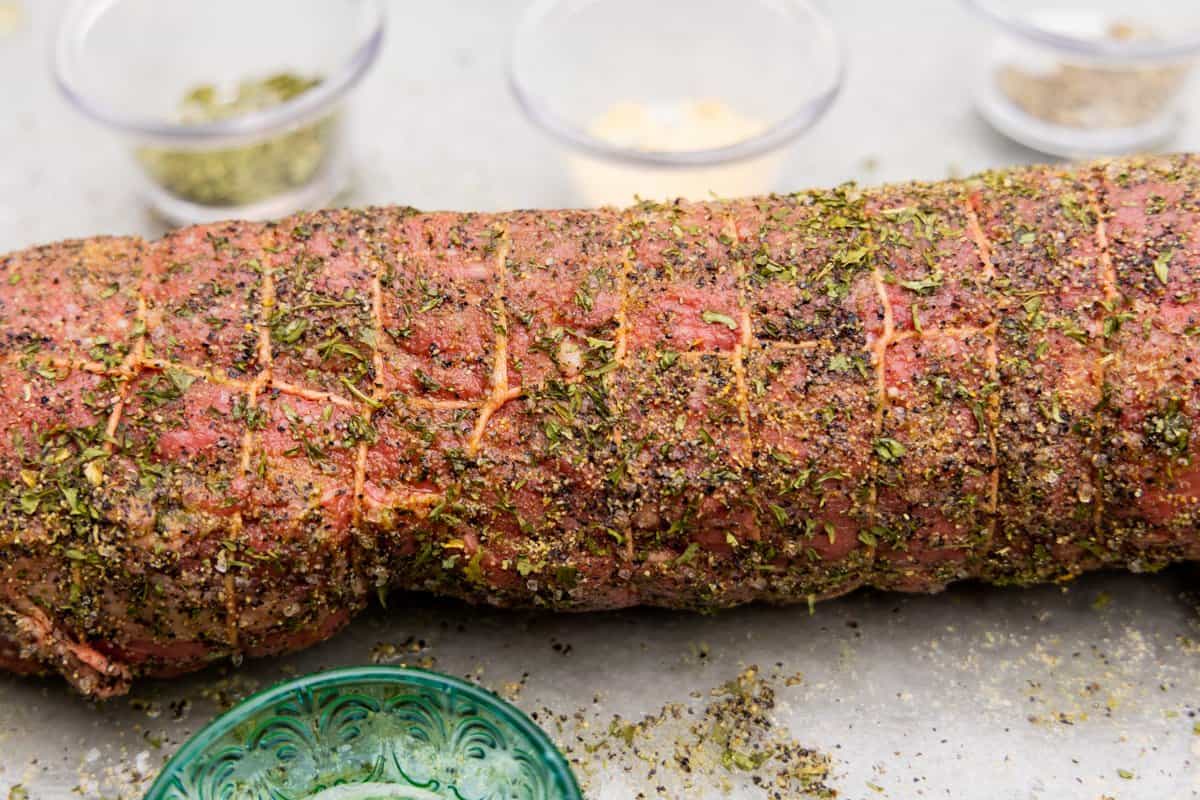 Beef tenderloin trussed with butcher twine and seasoned with spices