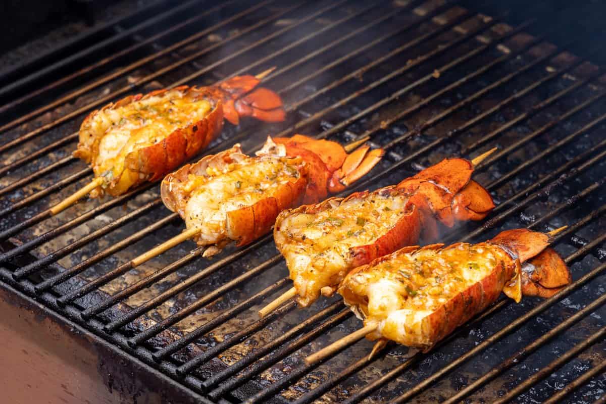 Lobsters smoking on grill