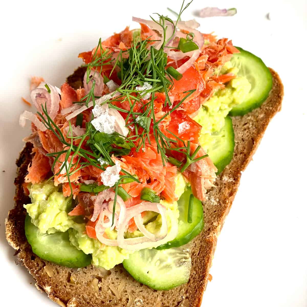 Toast with smoked salmon, cucumbers, dill, and shallots.